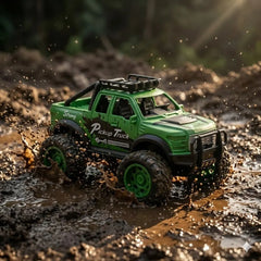 A realistic product lifestyle shot of a miniature green off-road pickup truck toy resting on a light wooden floor. The toy truck features oversized black rugged tires with green rims, a black roof rack, and side decals reading "Strong Pickup Truck". In the softly blurred background, a warm, brightly lit child's playroom features a white storage shelf with stacked children's books and cozy decor.