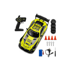 A yellow and black remote control race car kit with a remote controller, four black wheels, orange cones, wrenches, a blue battery, and a USB charging cable, all arranged on a white background.