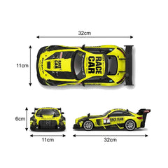 A yellow and black scale model race car shown from three angles with dimension arrows and labels indicating 32 cm length, 11 cm width, and 6 cm height on a white background.