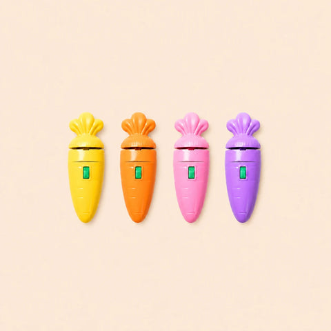 Carrot Projector Toy in use projecting colourful scenes in a dark room