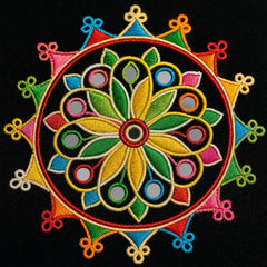 Black | A vibrant, circular embroidered floral mandala patch on a black fabric background. The patch features a central yellow and green flower with red, blue, pink, and orange accents, surrounded by a multi-pointed star design.