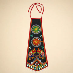 Black | A traditional Indian black cotton apron with red neck and waist ties, decorated with colorful hand-embroidered motifs including elephants, floral patterns, and geometric designs, set against a solid beige background.