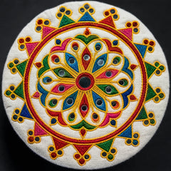 White | A round white embroidered cushion cover featuring a vibrant, symmetrical mandala design with red, yellow, green, blue, and pink threadwork, set against a solid black background.